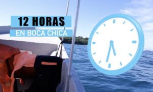 A ship on the ocean, a clock and the words 12 horas en Boca Chica